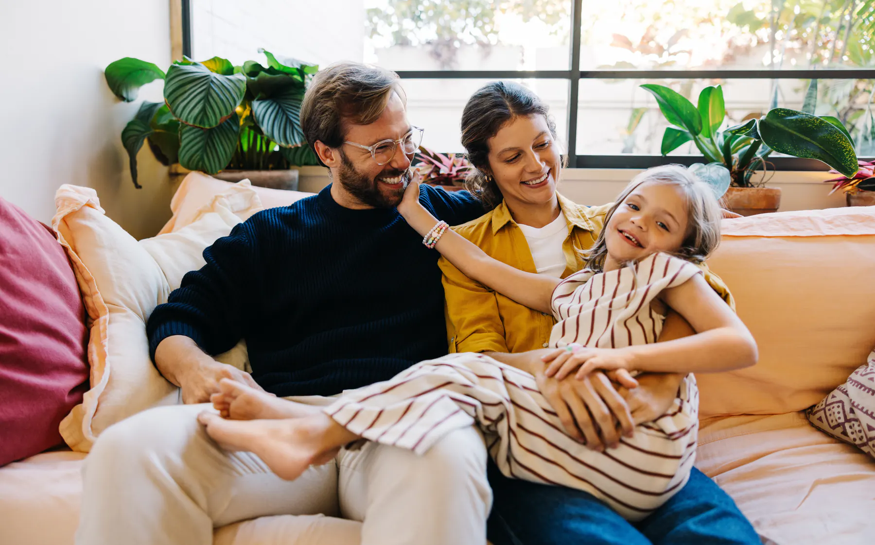 Family smiling together at home