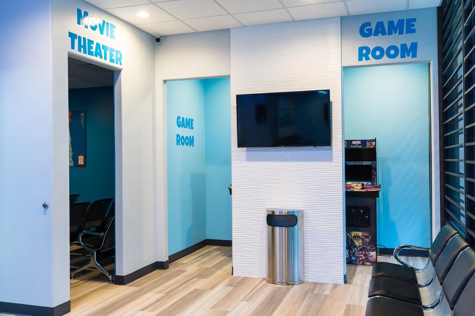 Entrances to the movie theater and game room inside Fresca Dental