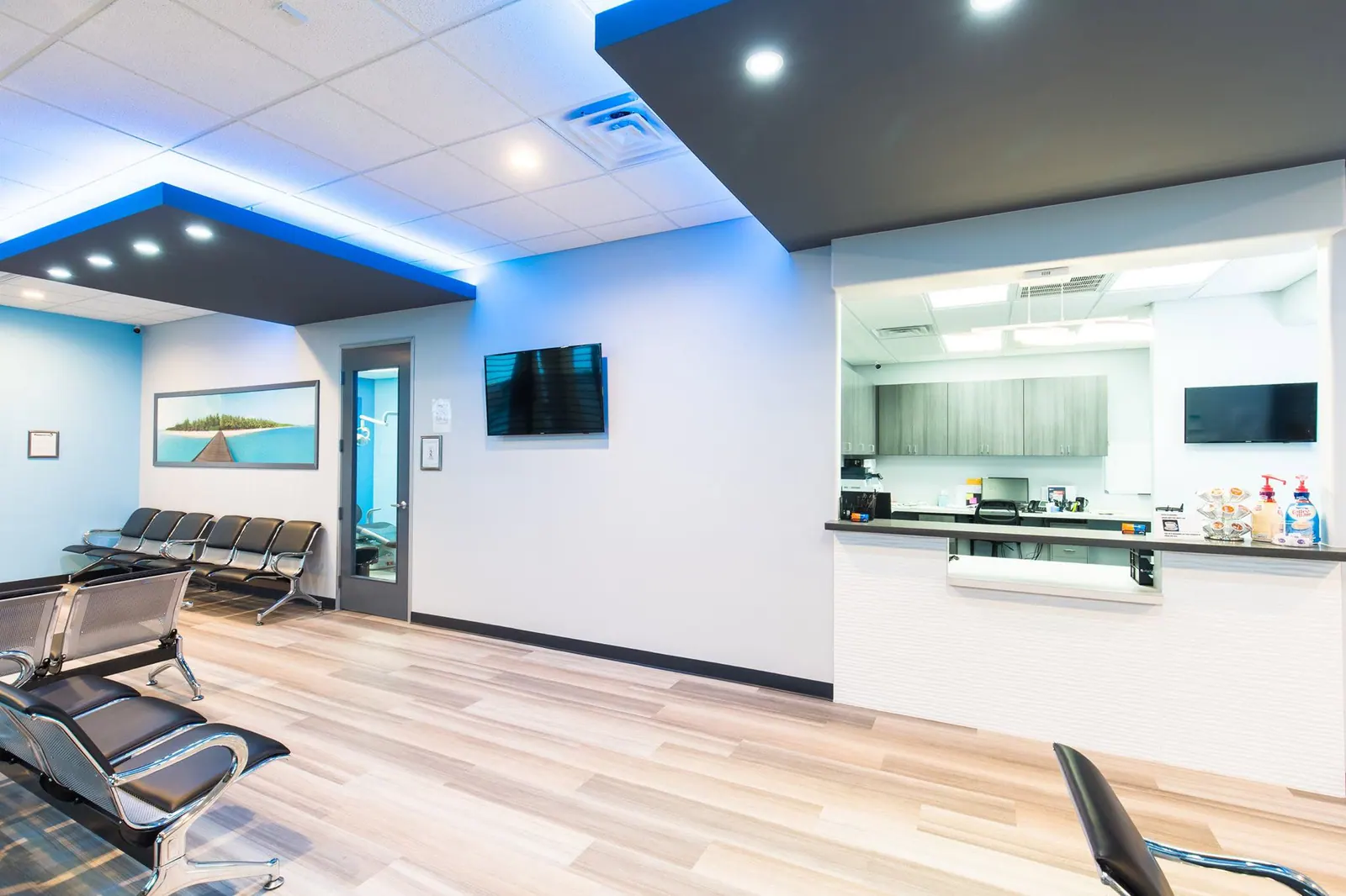 Reception counter and waiting-room seating inside Fresca Dental